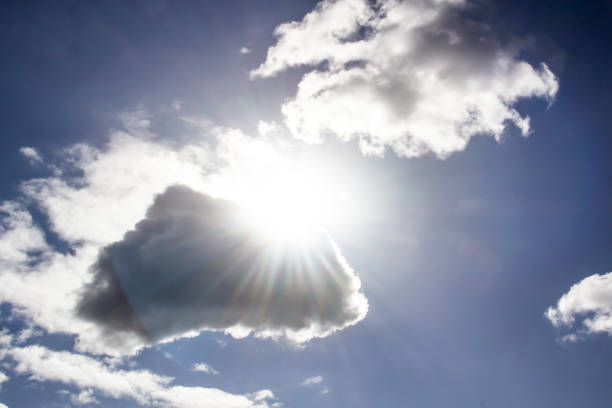 istock Clouds in the blue sky with a sun light. A miracle Gods light against background. Pattern from clouds in the sky. 1219512699