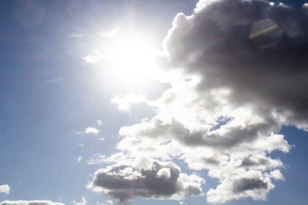 istock Clouds in the blue sky with a sun light. A miracle Gods light against background. Pattern from clouds in the sky. 1219512700