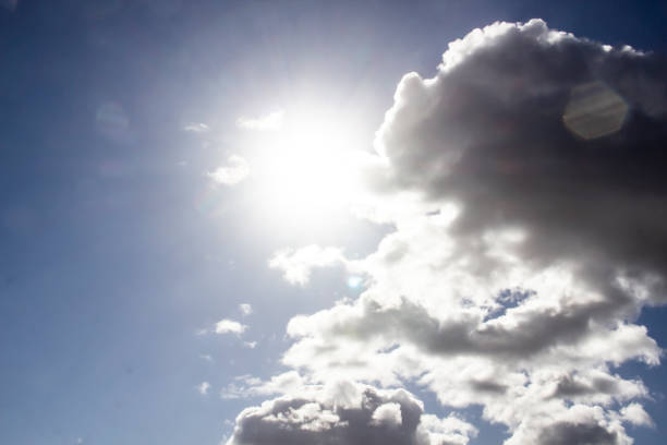 istock Clouds in the blue sky with a sun light. A miracle Gods light against background. Pattern from clouds in the sky. 1219512703