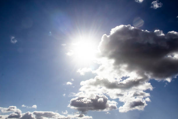 istock Clouds in the blue sky with a sun light. A miracle Gods light against background. Pattern from clouds in the sky. 1219512704