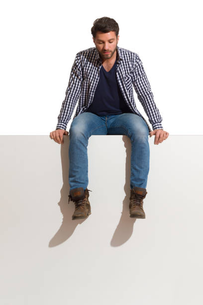 istock Pensive Man Is Sitting On A Top Thinking And Looking Down 1219514610