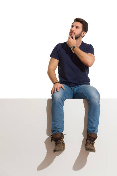 istock Pensive Man Is Sitting On A Top, Thinking And Looking Up 1219514613