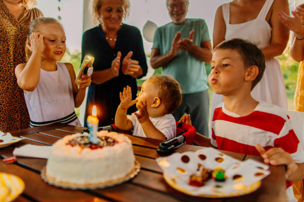 istock Happy family celebrating baby's first birthday 1219514763