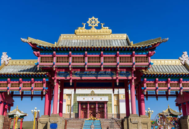 a big Buddhist monastery (khurul) on the background of clear blue sky a large Buddhist monastery (hurul) against a transparent blue sky. religious inscriptions, the symbolism, the solemnity republic of kalmykia stock pictures, royalty-free photos & images