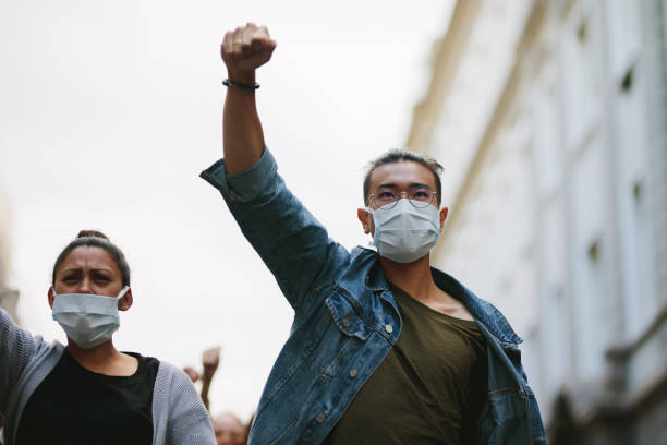 istock People protesting and giving slogans in a rally 1219516084