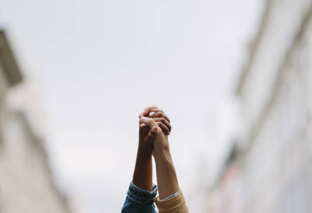 istock Protestors hands raised up in the air 1219516131