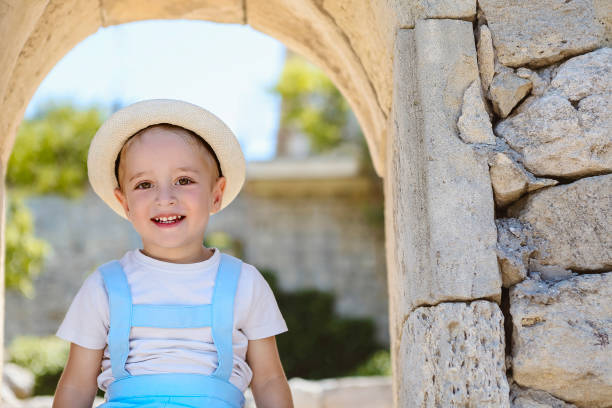 istock Satisfied boy in hat enjoying vacation 1219516876