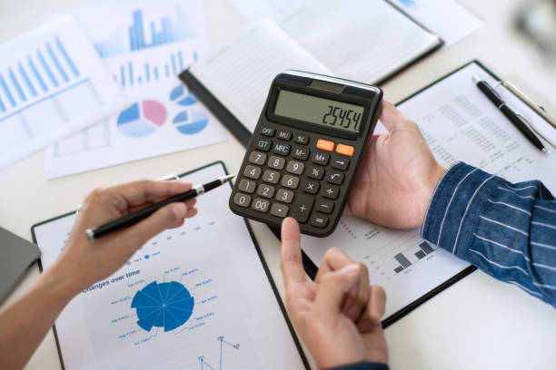 istock Business team working with plan on office desk with new startup project analyzing financial document data charts and graphs in Meeting and successful teamwork Concept 1219517033