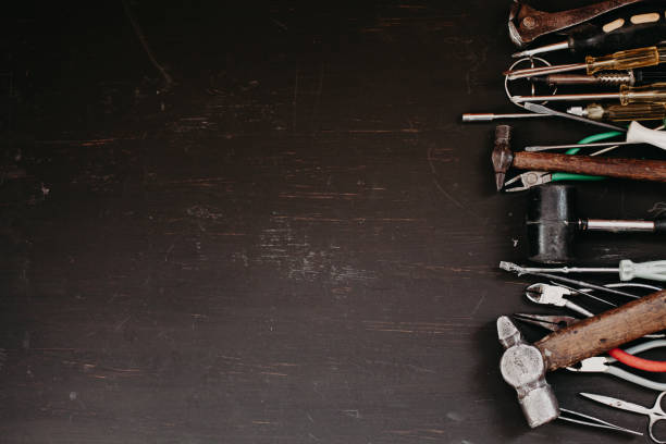 istock tools to work on repairs against a dark background 1219517282