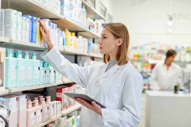 istock One young pharmacist is looking for a product on the shelves. 1219519011