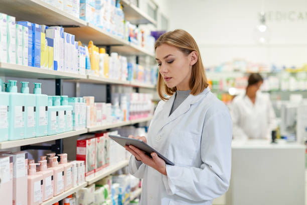 istock One young pharmacist taking inventory on a digital tablet. 1219519040