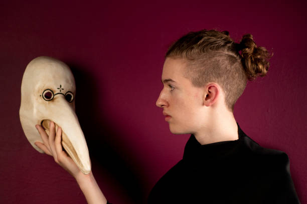 istock Young boy with plague doctor mask 1219520122