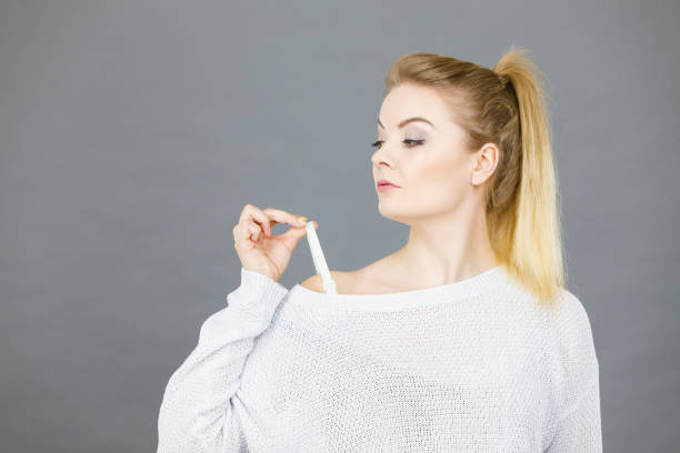 istock Woman holding her bra strap 1219520533
