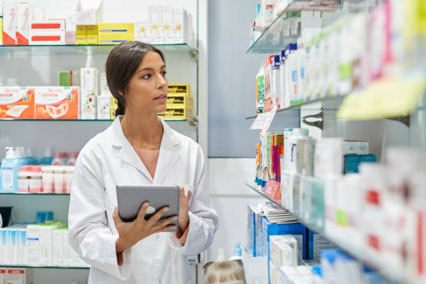 istock One young pharmacist taking inventory on a digital tablet. 1219521269