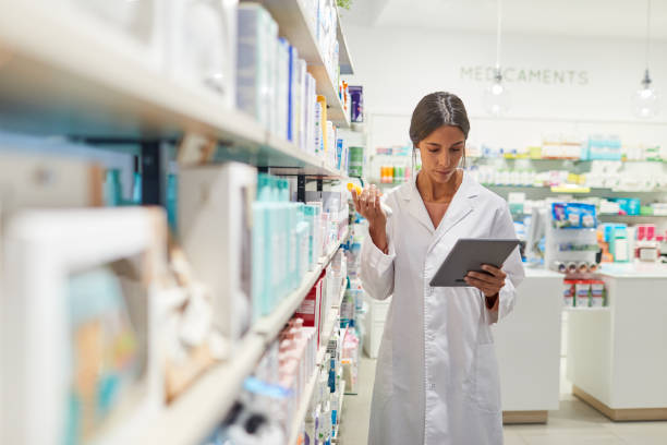 istock One female pharmacist taking inventory on a digital tablet. 1219521792