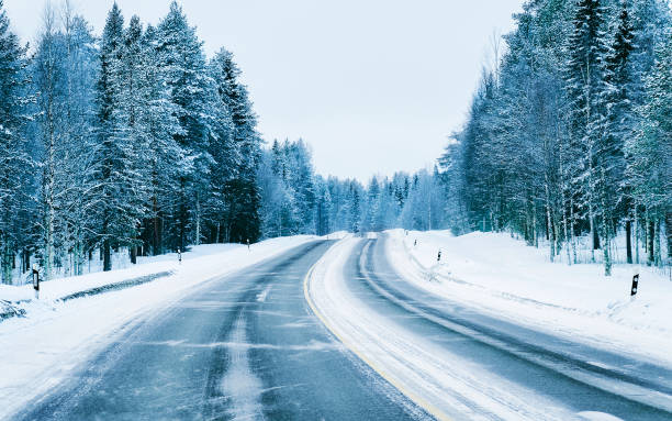 istock Road in snowy winter Lapland 1219523098