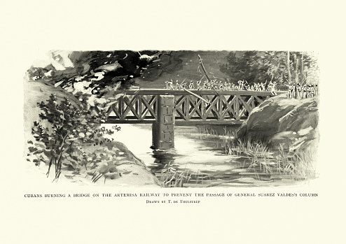 Vintage engraving of a scene from the Cuban War of Independence, Cubans burning a bridge on the Artemisa railway to prevent the passage of General Suarez Valde's column