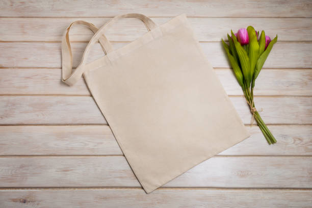 istock Tote bag mockup with pink tulips 1219524643