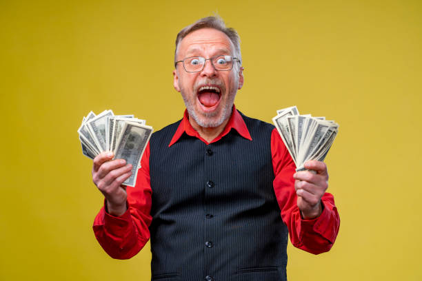 istock Much money in hands, dollars in hands. 1219524726