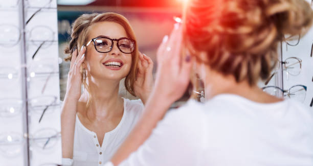 istock Young girl buys glasses. 1219525639
