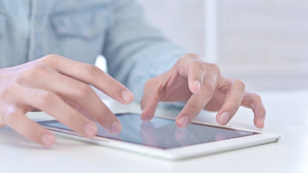 istock Close Up of Young Guy Hands doing Creative work on Tablet 1219525703