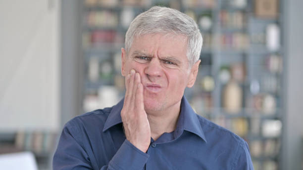 istock Portrait of Sick Middle Aged Man having Toothache 1219526540