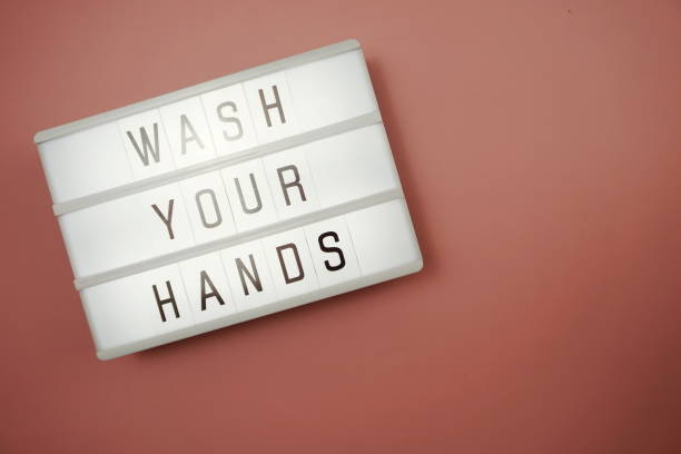 istock Flat lay Wash Your Hands word in light box with space coy on pink background 1219526605