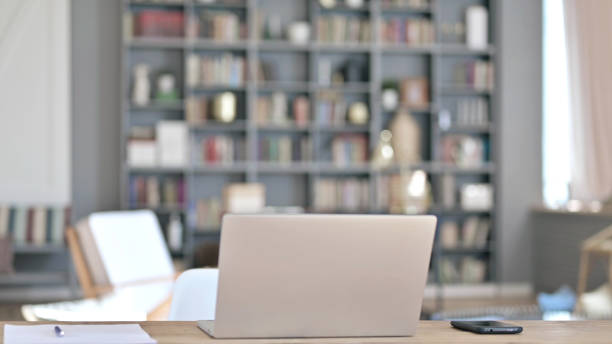 istock Laptop on Desk in Empty Office 1219526609
