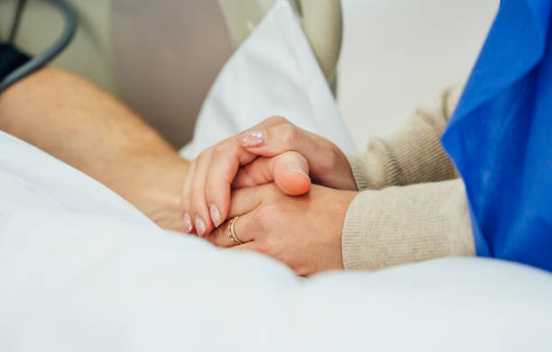 istock Holding patient hands in a hospital. 1219527156