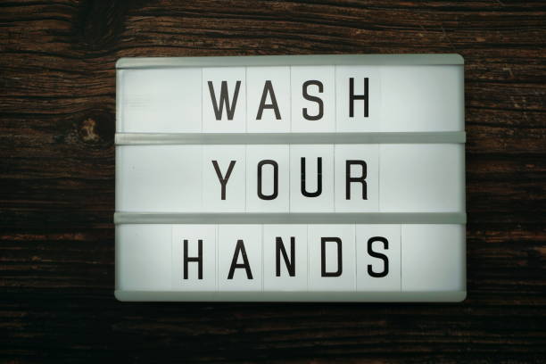 istock Wash Your Hands word in light box with space copy on wooden background 1219527298