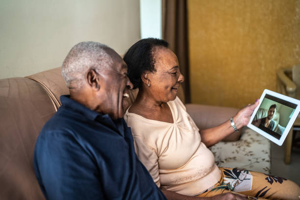 Senior couple on a video calling using a digital tablet at home