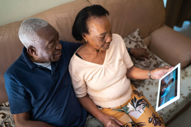 istock Senior couple on a video calling using a digital tablet at home 1219530429