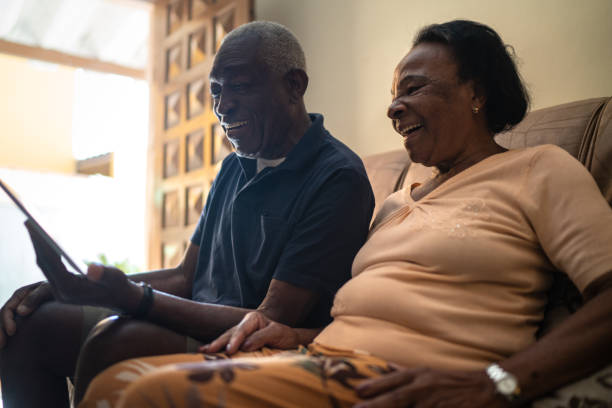 istock Senior couple on a video calling using a digital tablet at home 1219530472