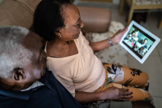 istock Senior couple on a video calling using a digital tablet at home 1219530486