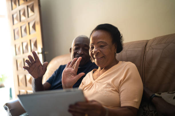 istock Senior couple on a video calling using a digital tablet at home 1219530497