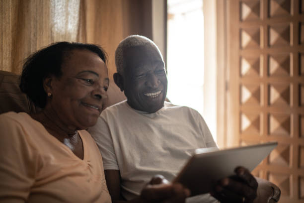 istock Senior couple on a video calling using a digital tablet at home 1219530789