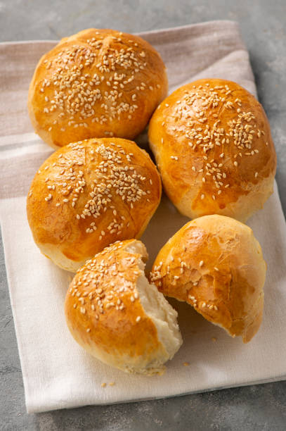 istock Homemade fresh bread buns with sesame seeds. 1219536561