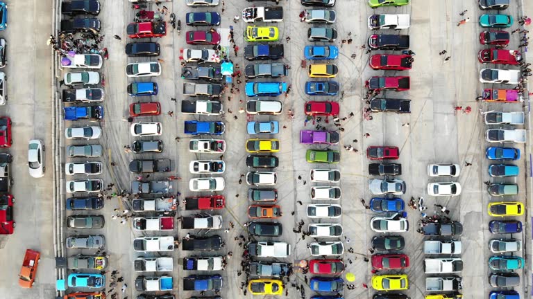 Aerial view car show on cement car parking.