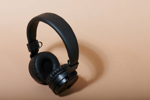 istock Black headphones above top view 1219544975