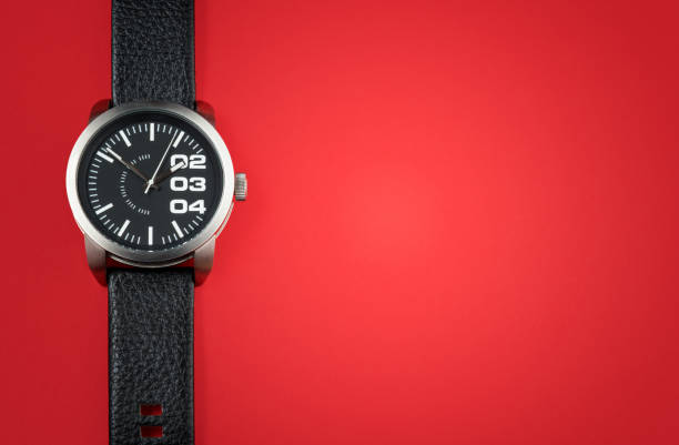 istock Modern black watch on red background 1219544989