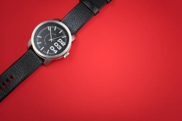 istock Modern male watch on red background 1219545203