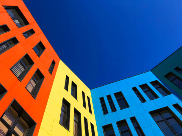 istock Multi-colored facades of the school with black window frames. 1219545272