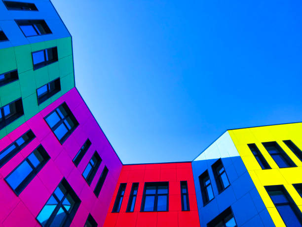 istock Multi-colored facades of the school with black window frames. 1219545295