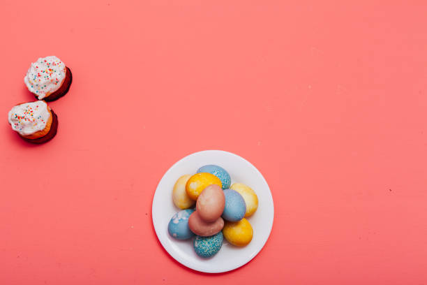 istock Family Easter Easter holiday egg cake pink background 1219547469
