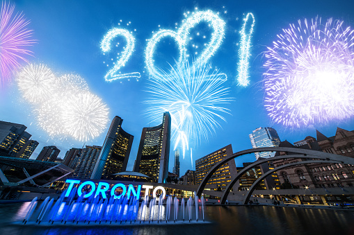 New Year's 2021 Fireworks firework exhibition in Toronto.\n\nNote for inspectors: I don't understand, this image is ok, as you can see:\nhttps://www.istockphoto.com/photo/toronto-sign-in-city-hall-and-nathan-phillips-square-ontario-canada-gm1180288870-330611746\nhttps://www.istockphoto.com/photo/toronto-city-at-night-gm1186094638-334516462\nhttps://www.istockphoto.com/photo/toronto-canada-gm873669950-243975967\nhttps://www.istockphoto.com/photo/nathan-phillips-square-in-toronto-at-night-gm626426058-110612045