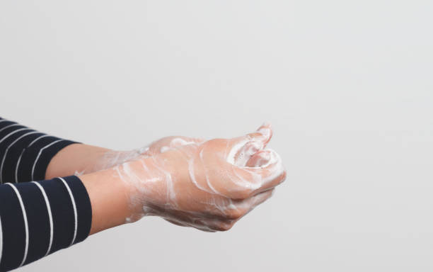 istock Hygiene to protect human health from viruses, hand washing with soap process. 1219552140