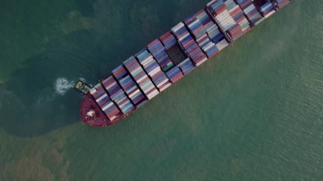 aerial view shot of Commercial port export and import goods and container ship