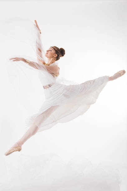 istock Ballerina jump in the clouds 1219553258