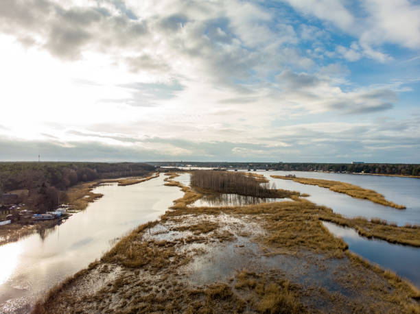 istock River Lielupe areal view on a sunny spring day with cloudy sky. 1219555004