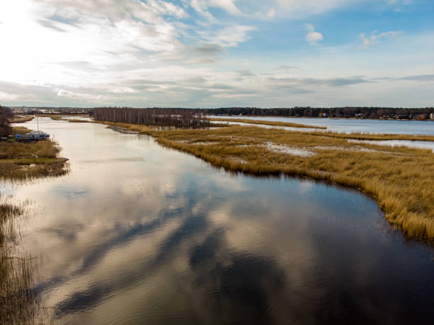 istock River Lielupe areal view on a sunny spring day with cloudy sky. 1219555018